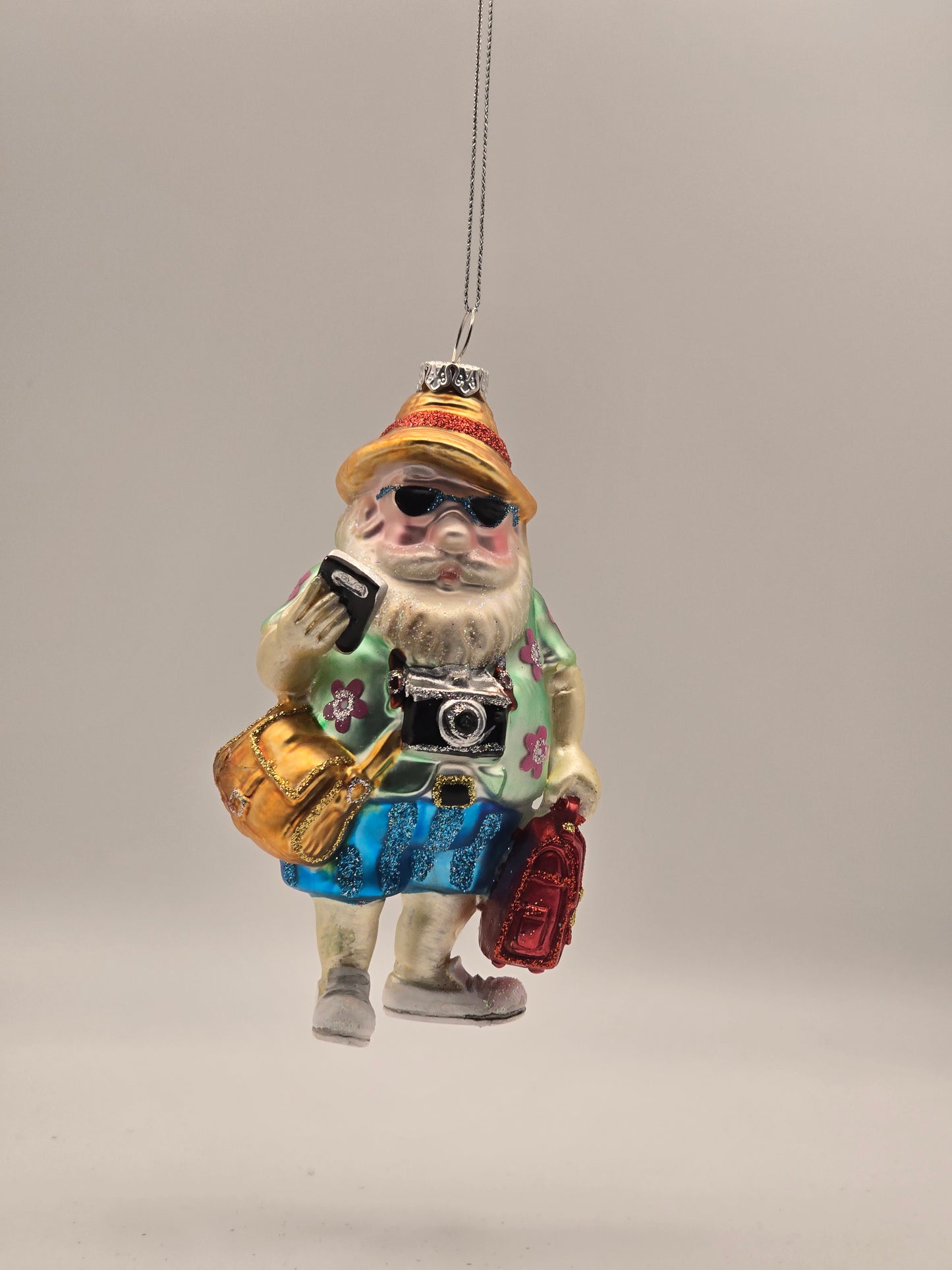 Weihnachtsmann im Urlaub mit Kamera