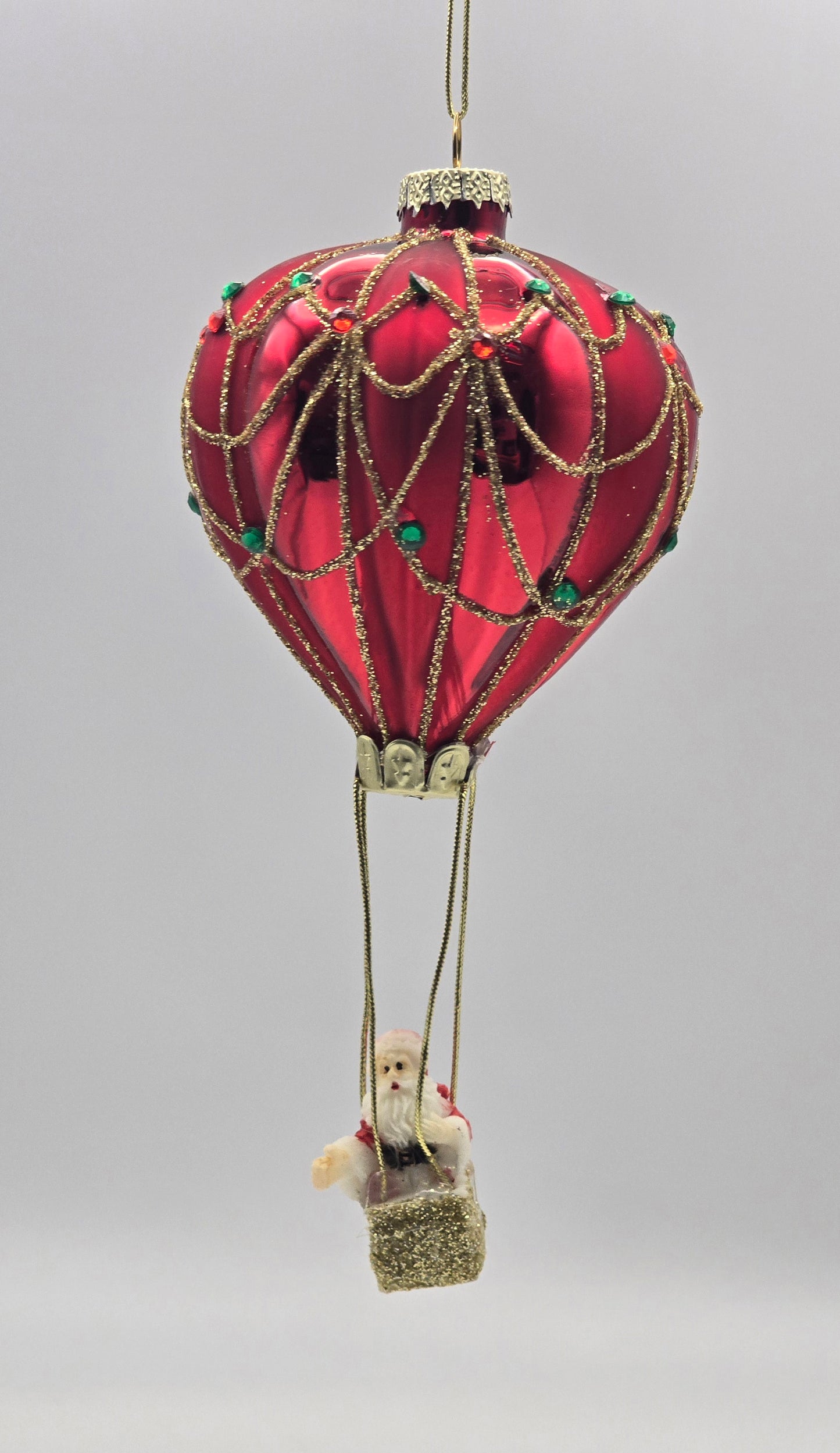 Weihnachtsmann im Heißluftballon rot