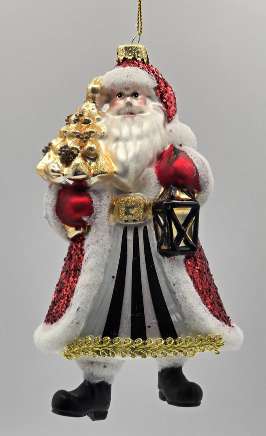 Weihnachtsmann mit Lampe und goldenen Baum