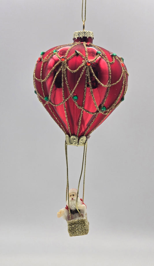 Weihnachtsmann im Heißluftballon rot